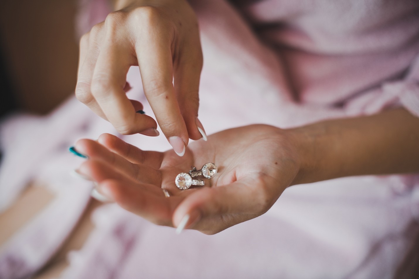 engagement rings in hand